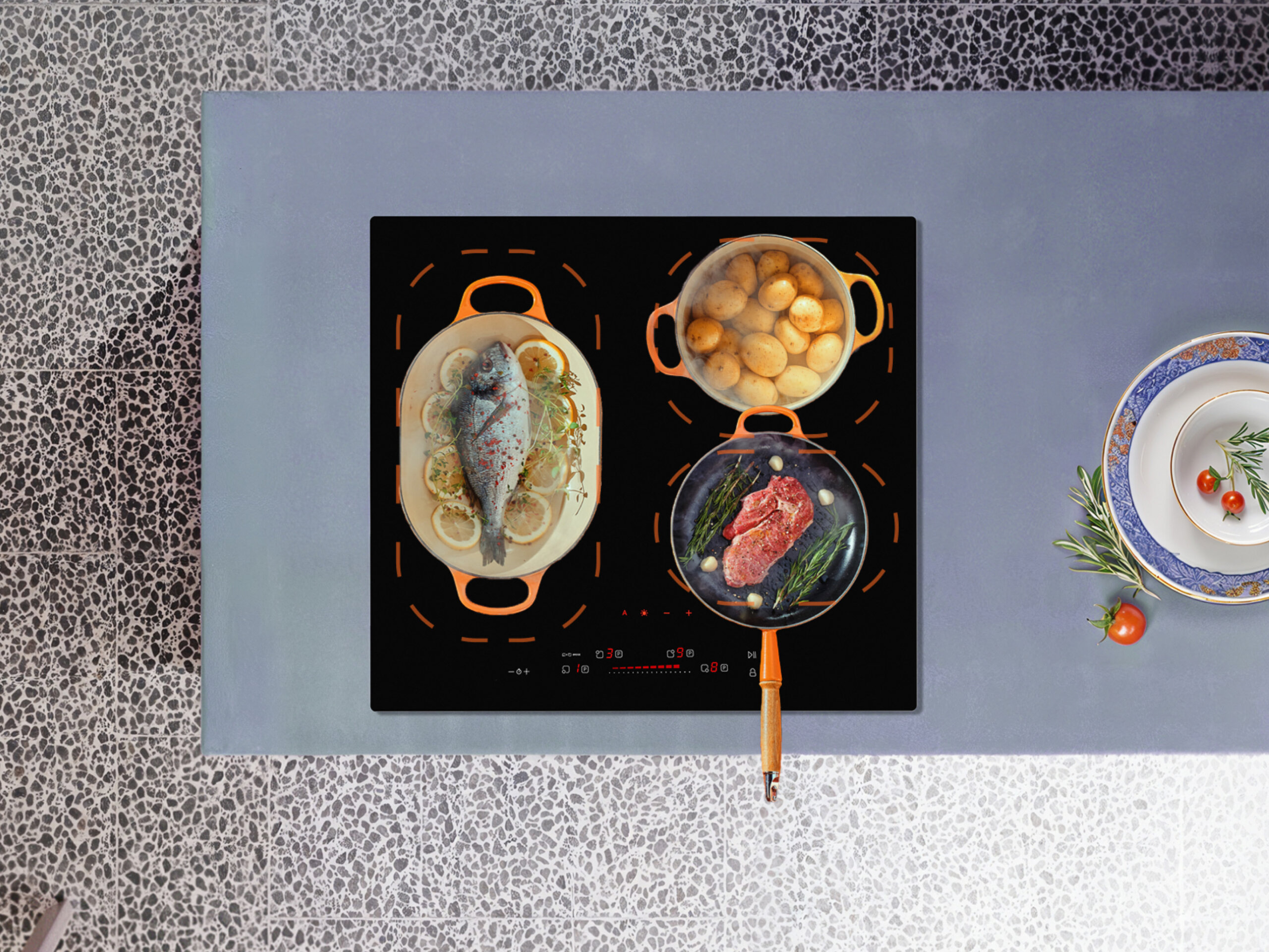 Płyta indukcyjna z potrawami na blacie kuchennym.